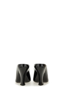 Givenchy women’s sculpted leather pumps in black patent leather with a sleek glossy finish and block heel