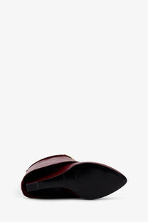 Givenchy women’s burgundy patent leather ankle boot with pointed toe and gold-tone buckle detail