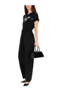 Black Givenchy handbag with glossy finish and structured design complementing Givenchy women’s shirt tape black collection