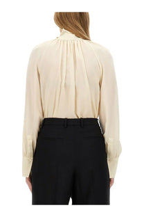 Beige silk blouse with high neckline and gathered back detail by Givenchy women’s silk shirt white showing the back side