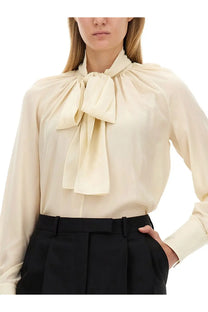 Cream-colored Givenchy women’s silk blouse with a prominent gathered bow at the neckline in white silk