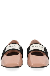Pink patent leather givenchy paris ballet flats with black elastic straps and white logo patches for women