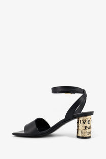 Givenchy women’s black leather heeled sandal with a gold-toned cork-inspired heel and Givenchy Paris branding