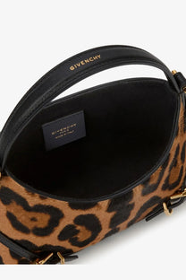 Black leather handle with gold-tone givenchy branding on a leopard-print pony skin crossbody bag