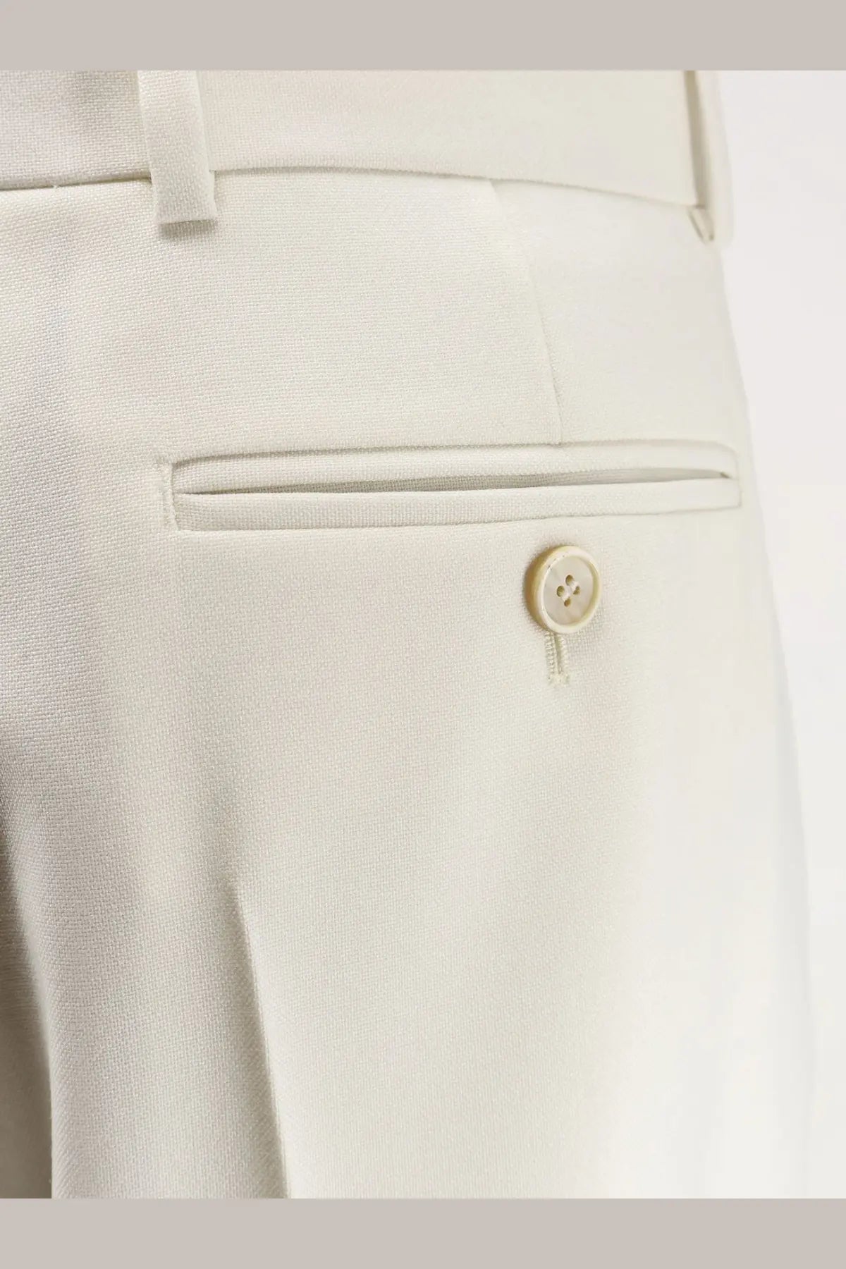 Cream-colored Givenchy women’s tailored wool and mohair trousers with subtle woven texture and matching button closure