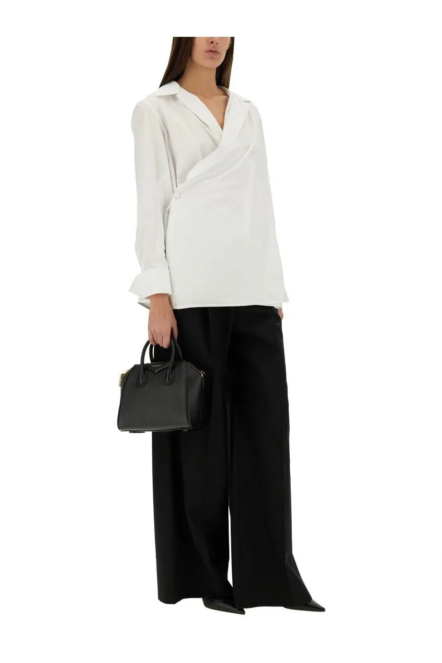 Black leather Givenchy antigona mini handbag paired with Givenchy women’s wrap around white shirt front view