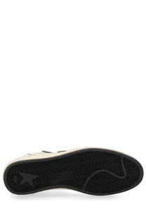 Black rubber sole with zigzag tread pattern and subtle star logo embossed on the heel of golden goose mens ballstar sneaker
