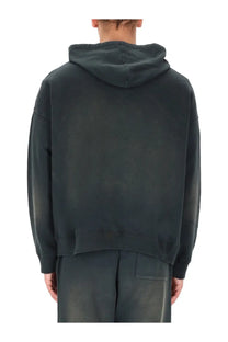 Dark gray oversized hoodie with relaxed fit and subtle faded texture from golden goose men’s black collection