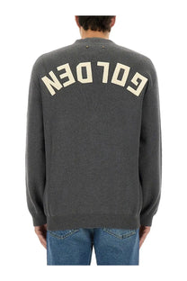 Back of a golden goose men’s lapel cardigan grey showing a dark gray knitted sweater with cream golden lettering