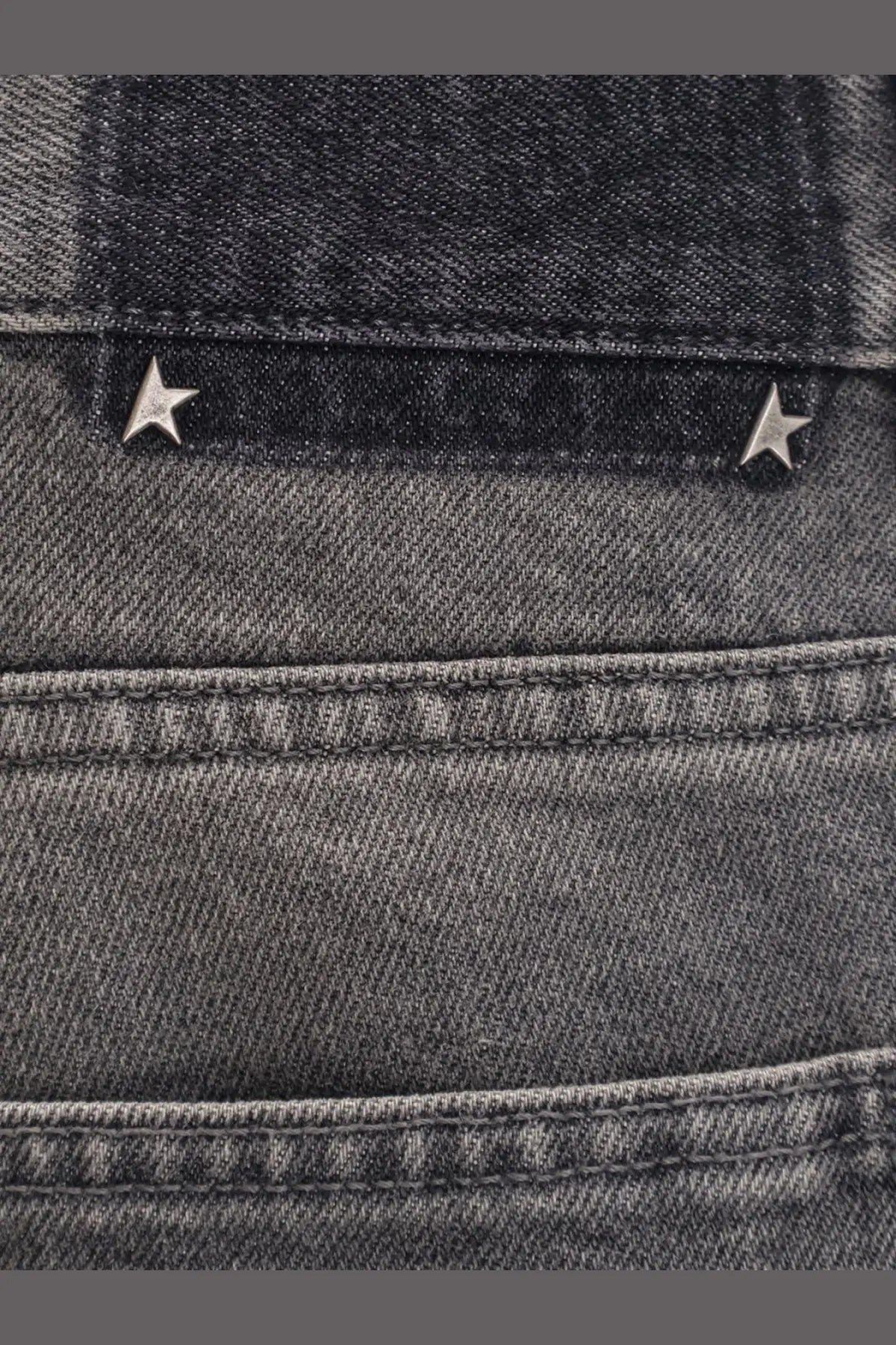 Back side of golden goose men’s parker denim jeans grey in dark gray with metallic star studs on the pocket
