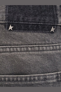 Back side of golden goose men’s parker denim jeans grey in dark gray with metallic star studs on the pocket