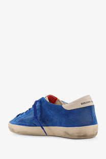 Golden Goose men’s superstar classic white sneaker in blue suede with beige rubber sole and red tag detail