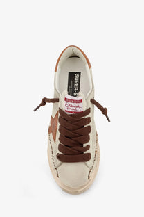 Golden Goose men’s super star leather sneaker in beige cream with brown laces and tan star side detail