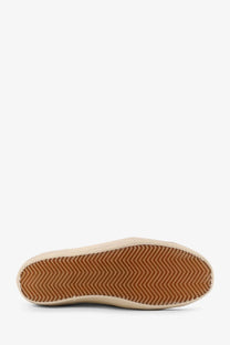 Beige canvas sneaker with brown rubber sole and chevron tread pattern in golden goose men’s super star leather sneakers black product