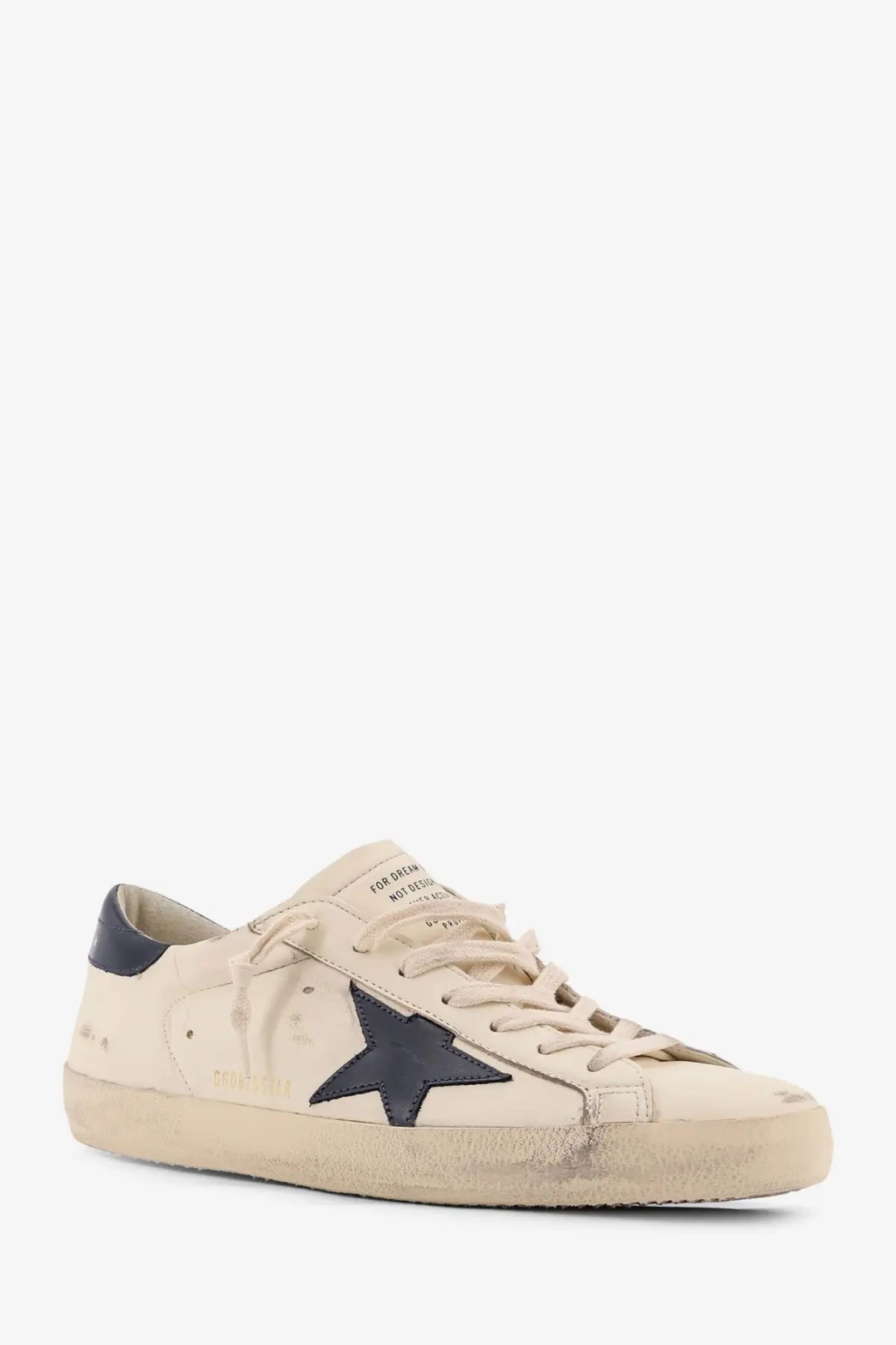 Golden Goose men’s Super Star leather sneakers in beige suede with navy blue star patch and distressed detailing