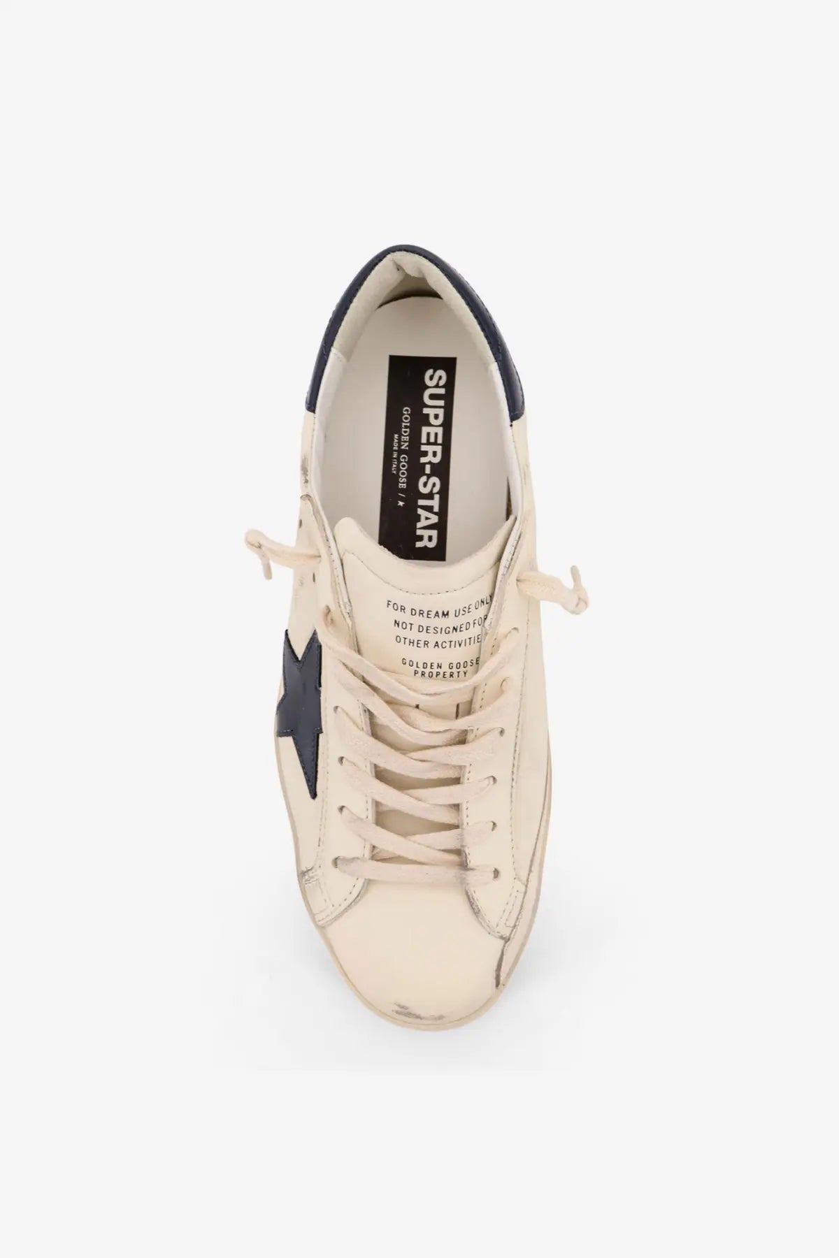 Cream-colored leather Golden Goose men’s Super Star sneaker with navy blue star and heel tab in black design