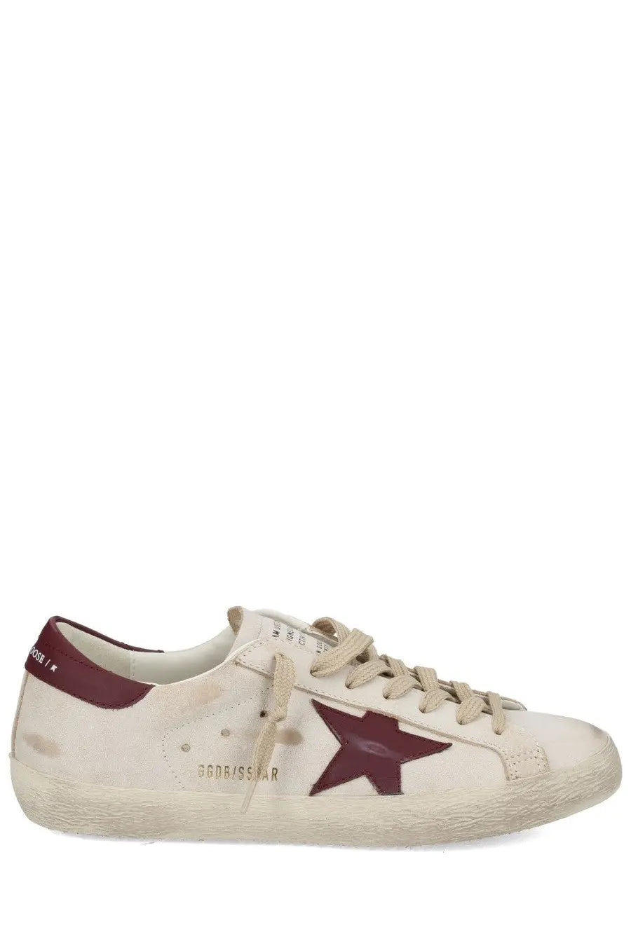 Cream-colored suede golden goose men’s superstar sneaker with maroon star emblem and matching heel tab
