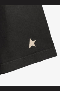 Black cotton shorts with subtle beige star embroidery on hem paired with golden goose unisex grey cotton shirt