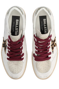 Golden Goose women’s ball star sneaker in white leather with maroon laces leopard star and gold glitter heel trim