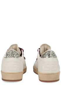 Golden goose women’s ball star sneaker white leather with glittery silver heel accents and burgundy laces