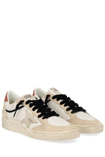 Golden Goose women’s Ballstar sneaker in beige and white with distressed suede, black velvet laces, and metallic star patch