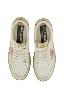 Golden Goose women’s ballstar sneaker in white leather with rose gold star accents and distressed rubber soles