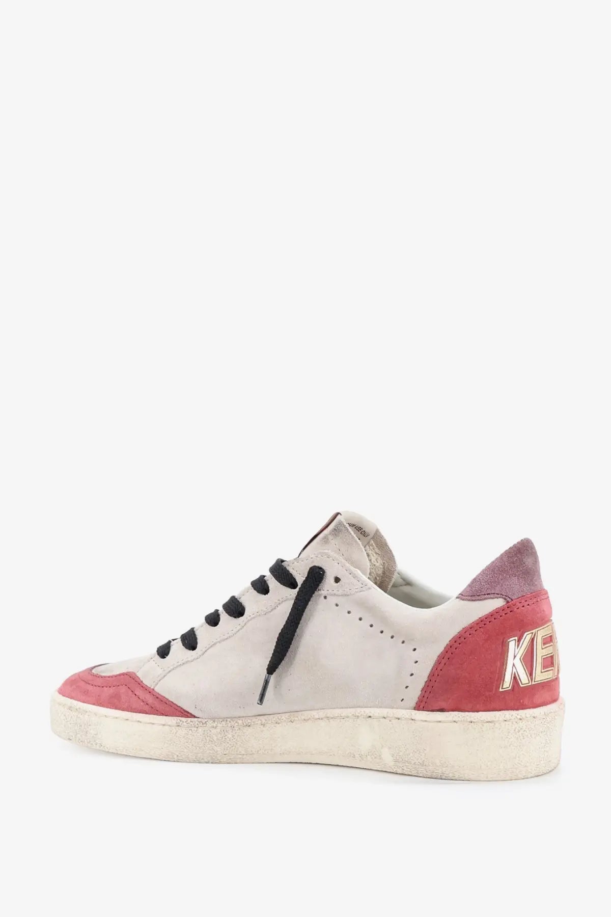 Back side of golden goose women’s ballstar beige suede sneakers with white and pink distressed design and black laces
