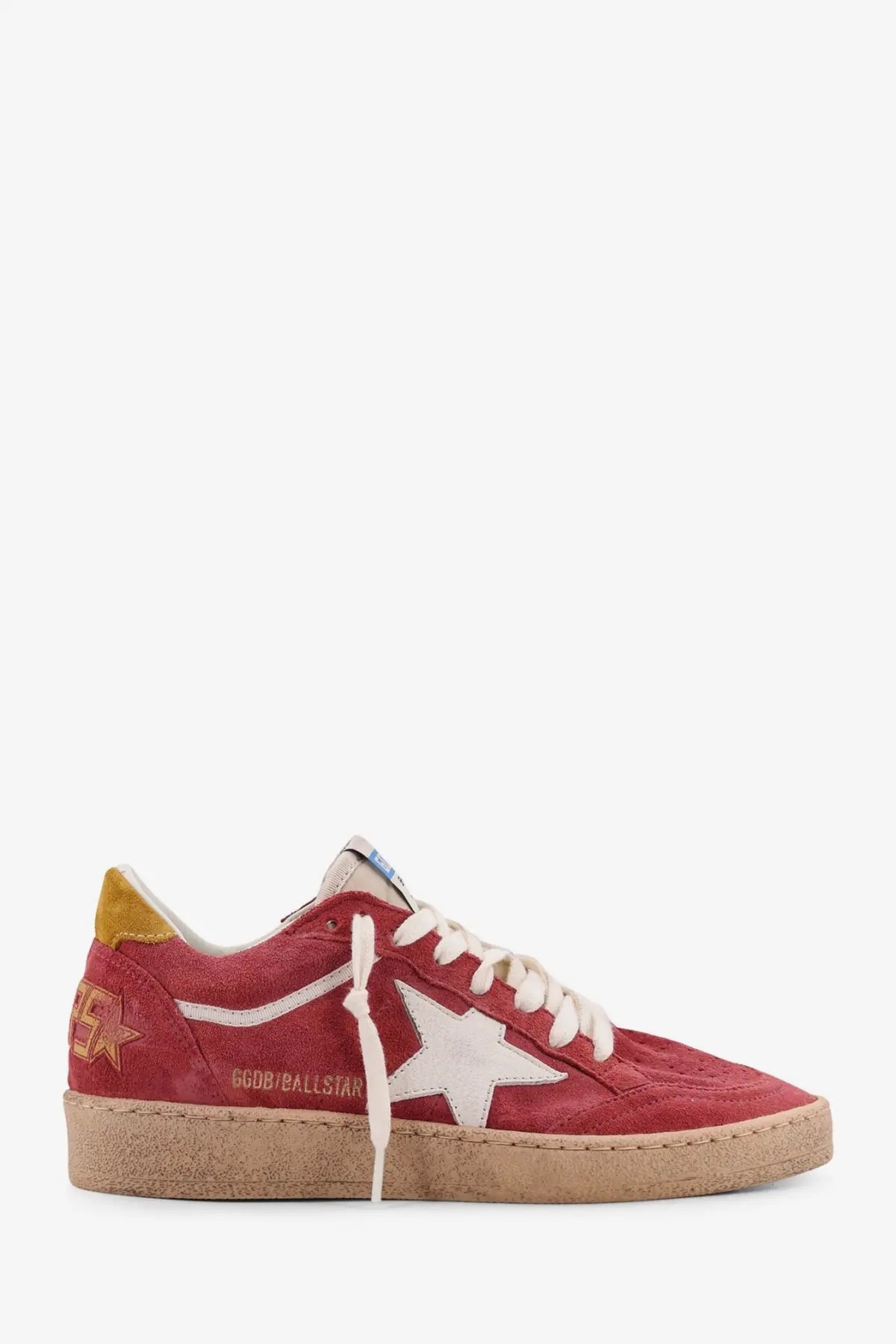 Golden goose women’s ballstar red suede sneaker with white star emblem and yellow heel tab visible from the back