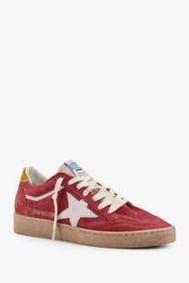 Golden Goose women’s Ballstar suede sneakers in red with a white star patch and cream-colored laces