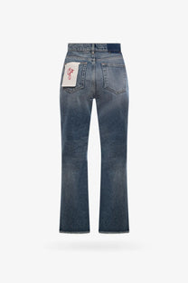 Back side of golden goose women’s derin new cropped flare jeans in faded blue denim with a white patch and red embroidery