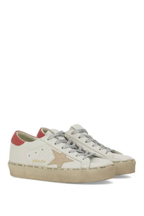 Cream-colored leather golden goose women’s hi star sneaker with tan star patch red heel tab and silver metallic laces