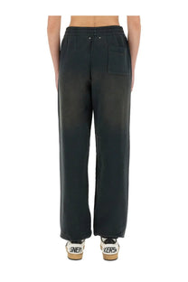 Back view of golden goose women’s black wide-leg sweatpants with elastic waistband and single patch pocket
