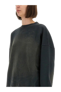 Dark gray oversized golden goose women’s journey sweatshirt with subtle faded texture and minimal embroidered logo on chest