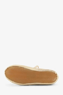 Beige golden goose women’s leather slip-on sneaker with tan rubber sole and zigzag tread pattern