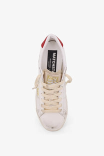Golden Goose women’s matchstar leather sneaker in white with red heel tab beige laces and golden sole accents