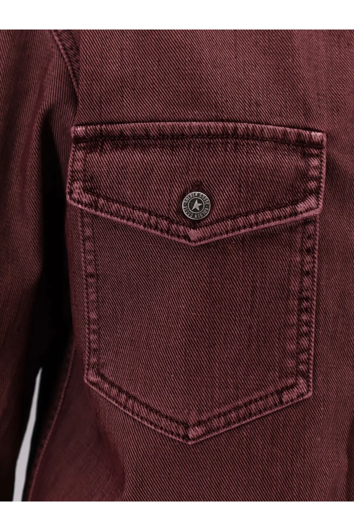 Maroon denim jacket pocket with a circular metal stone island logo button on golden goose women’s patty cotton shirt blue