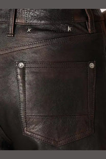 Back view of golden goose women’s peg leather trousers blue in dark brown with silver rivets and star-shaped studs