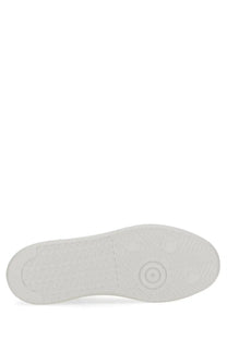 White rubber sole with textured grip pattern and circular tread design on golden goose women’s purestar sneaker white