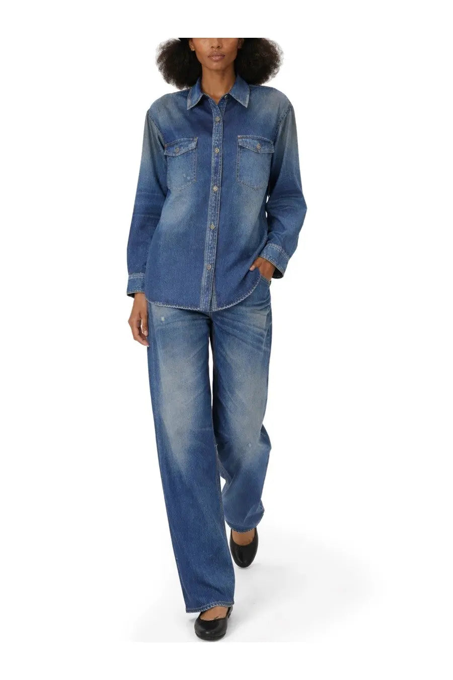 A pair of golden goose wide-leg denim trousers in faded blue wash with subtle distressing and buttoned fly