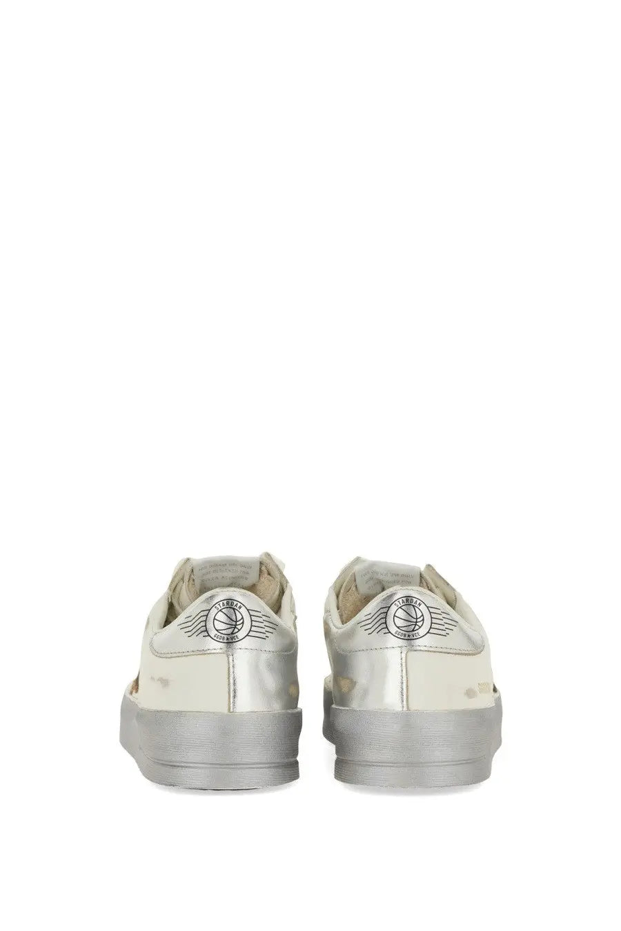 Silver metallic Golden Goose women’s Stardan sneaker with distressed finish and winged logo on the heel back side