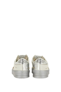 Silver metallic Golden Goose women’s Stardan sneaker with distressed finish and winged logo on the heel back side