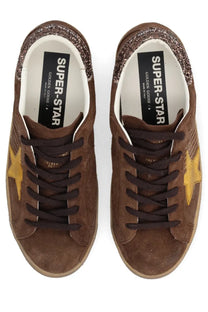 Golden Goose women’s Super Star sneaker in brown suede with a gold star and glittery brown collar accents