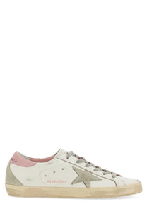 Golden Goose women’s super star sneaker in white leather with faded gray star pink heel tab and distressed rubber sole