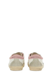 Golden Goose womens super star sneaker white with white and pink suede accents and distressed rubber sole
