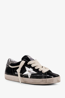 Black suede golden goose women’s superstar chenille sneaker with silver star emblem and cream-colored laces