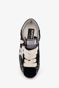 Golden goose women’s superstar chenille sneaker in black velvet with white laces and distressed glossy finish