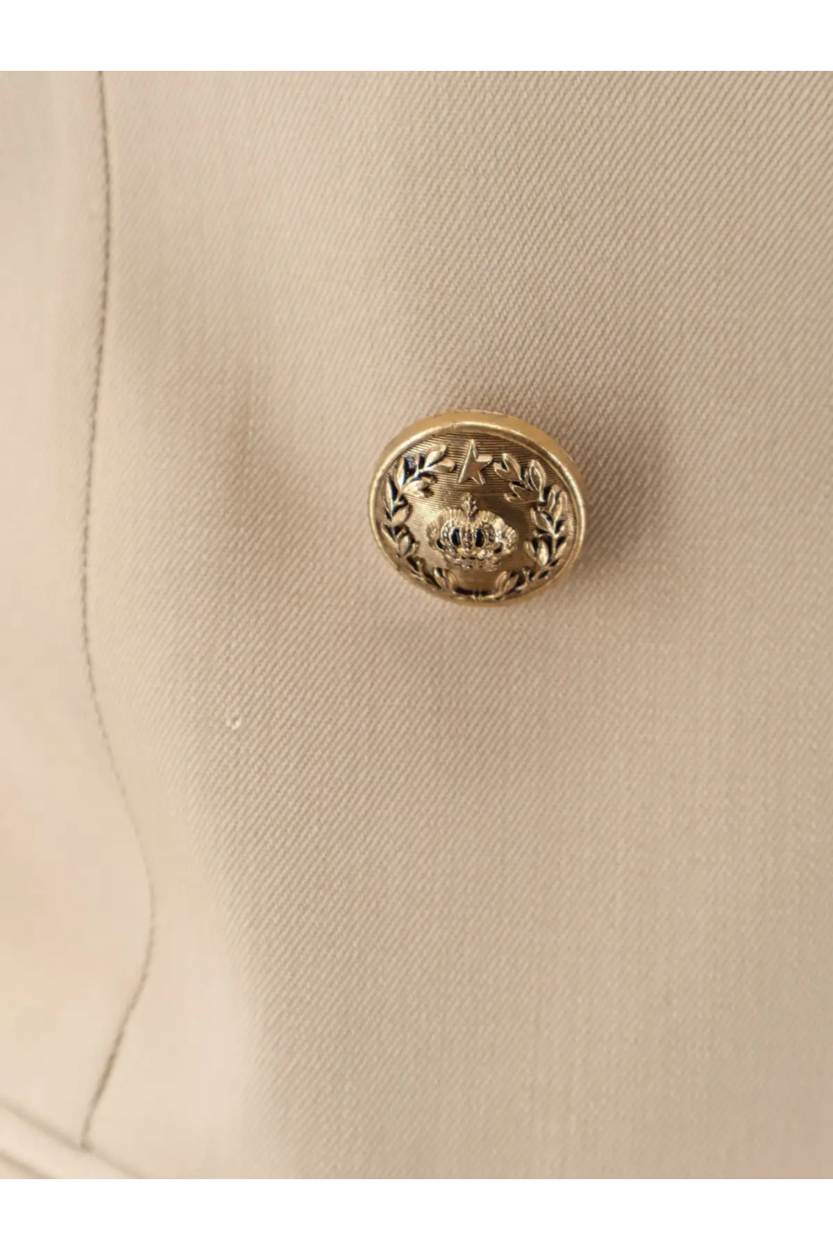 Gold-toned button with embossed crown and laurel wreath on golden goose women’s virgin wool blazer beige