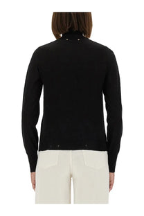 Golden Goose women’s black wool turtleneck sweater with worn effect and metallic star embellishments at neckline