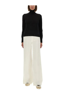 Golden Goose women’s black wool sweater with worn effect and subtle ribbed detailing at cuffs and hem