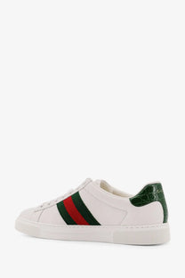 Gucci men’s ace low top leather sneakers in white with red and green stripe and dark green crocodile heel detail